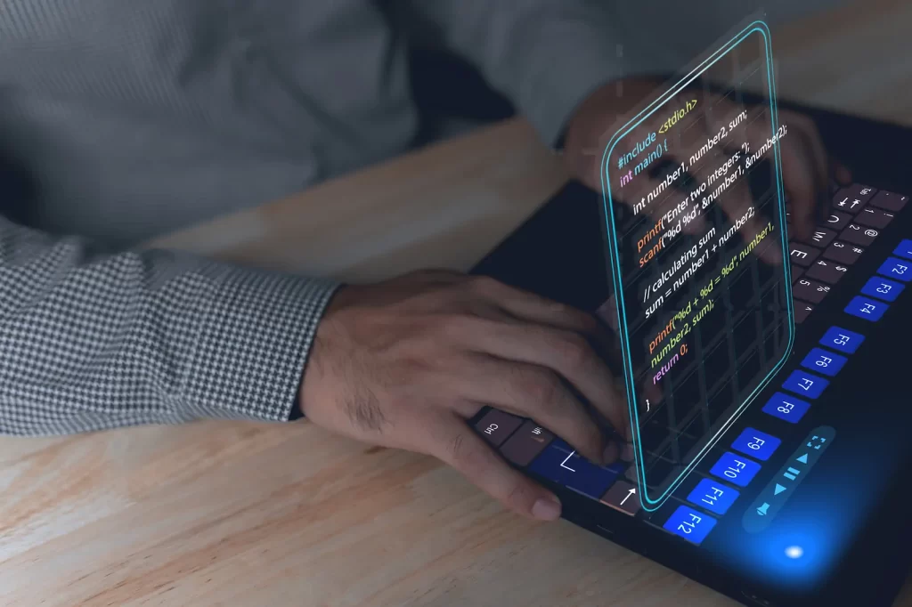 Developer coding with projected code over keyboard and screen