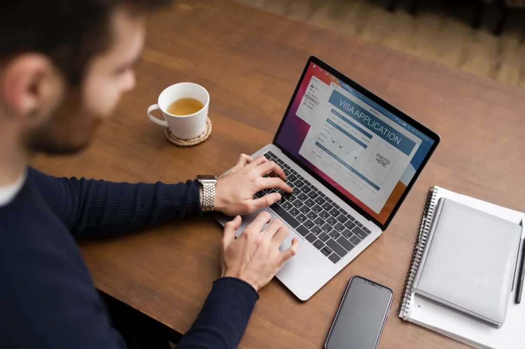 User reviewing web metrics and analytics on a laptop with a coffee mug.