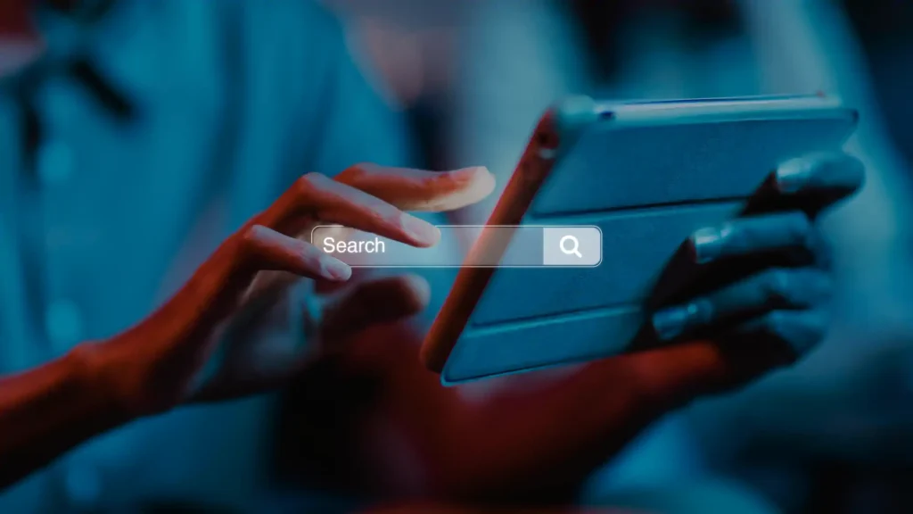 Person using a tablet with a search bar